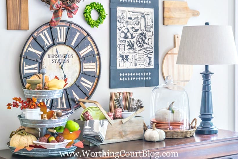 Sideboard decorated for fall with traditional fall colors.