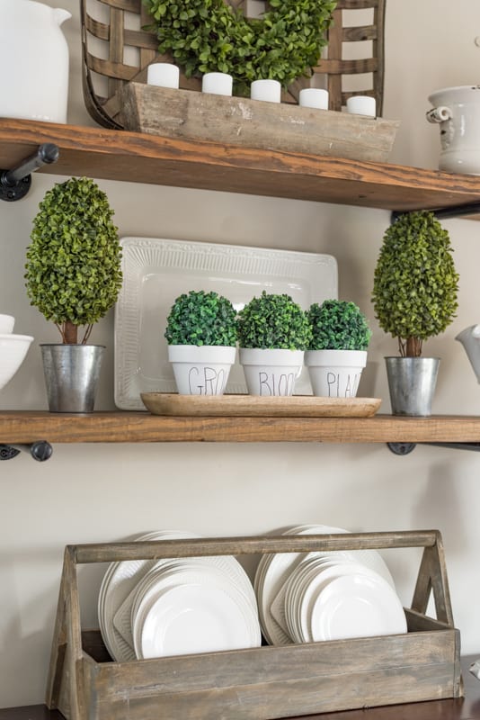 open shelves decorated with white accessories for spring