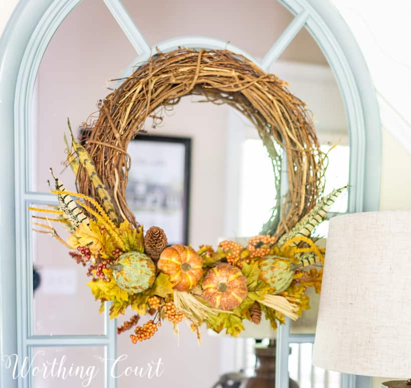 Grapevine wreath with fall picks.