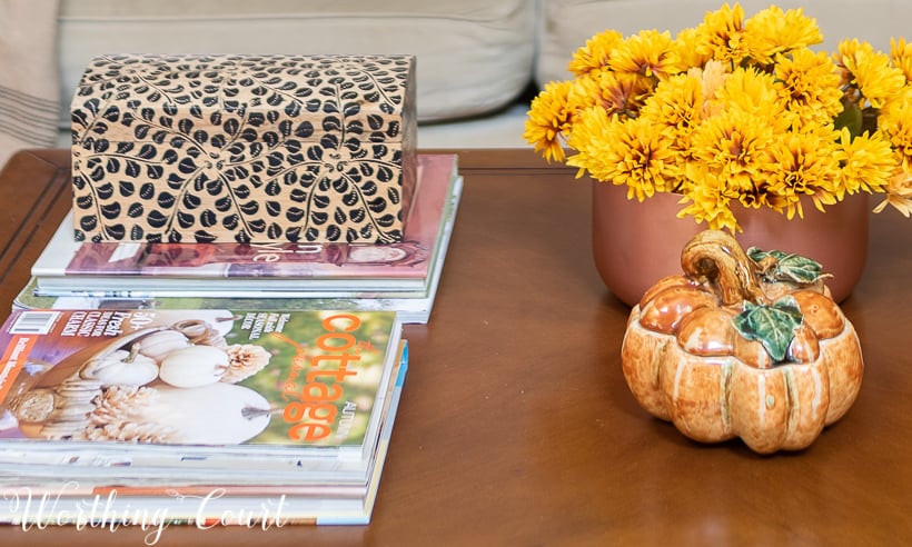 coffee table with mums and pumpkin for fall