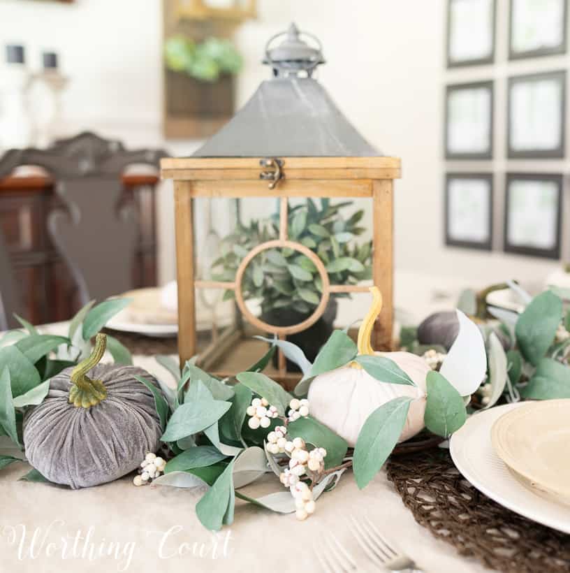 eucalyptus garland centerpiece with gray and white velvet pumpkins