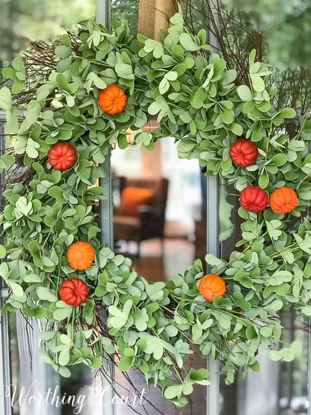 eucalyptus fall wreath with faux pumpkins