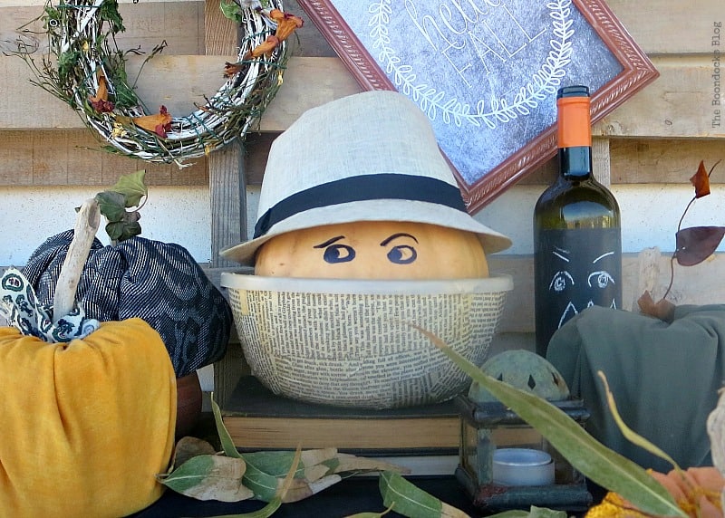 Halloween pumpkin with a hat on in a bowl