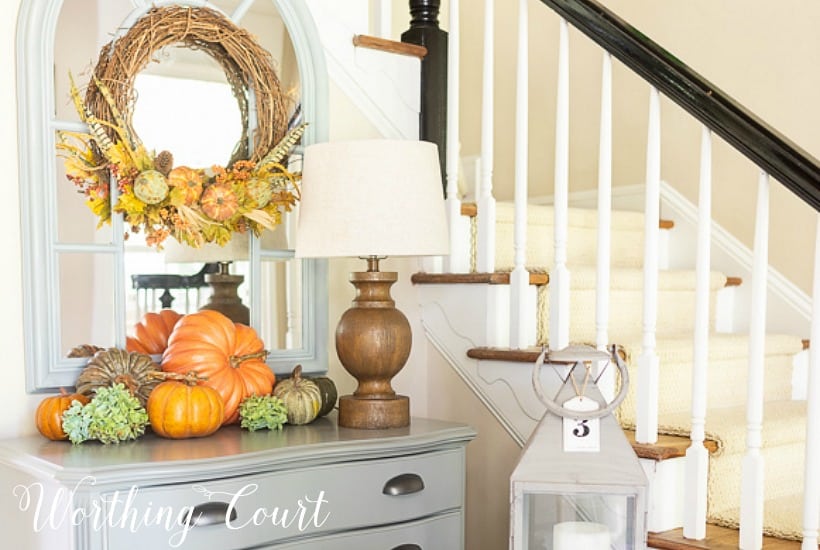 Fall pumpkin display and fall wreath.