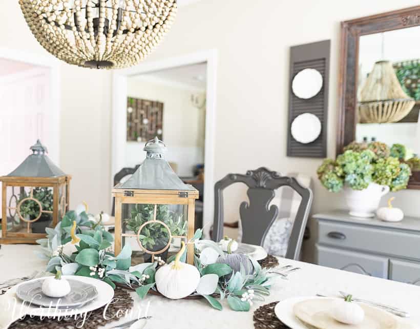 dining room decorated for fall with eucalyptus