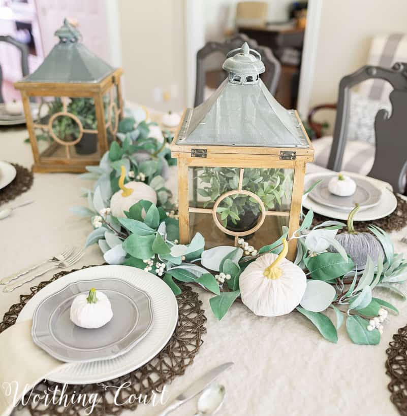 fall centerpiece with eucalyptus garland and velvet pumpkins