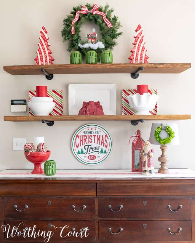 Open shelving with Christmas decor on it.