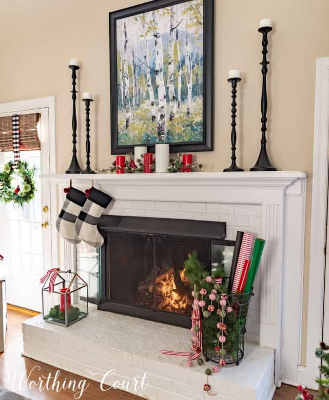 There are stockings hanging on the fireplace mantel.