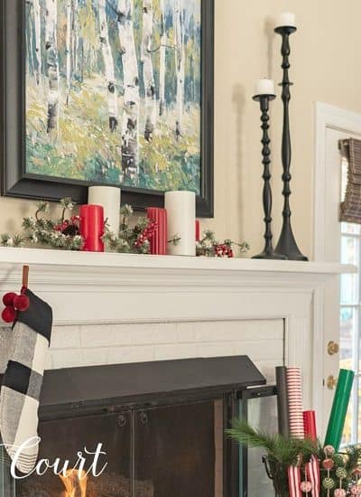 Mantel decorated for Christmas with red, white, green and black