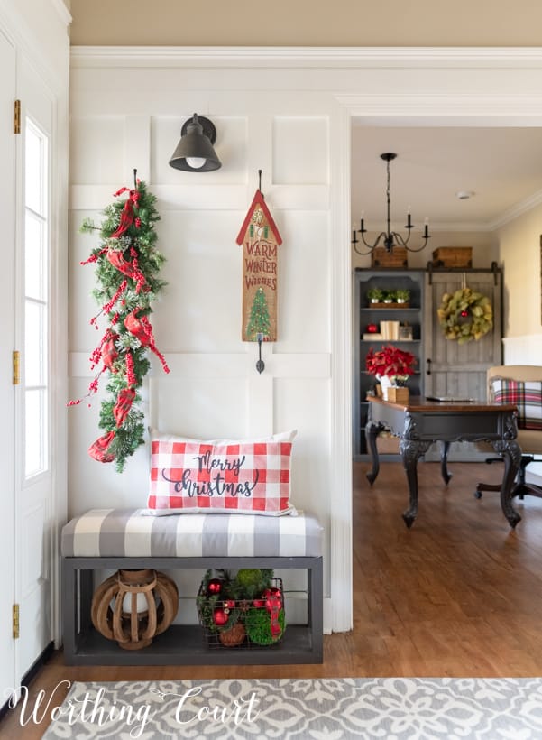 Red and green decorations are in the foyer.