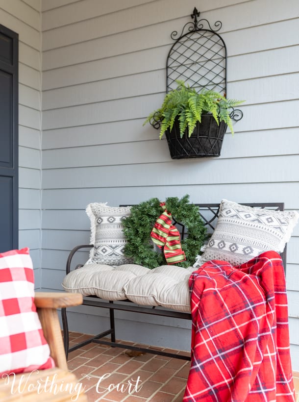 Outdoor bench with Christmas decor.