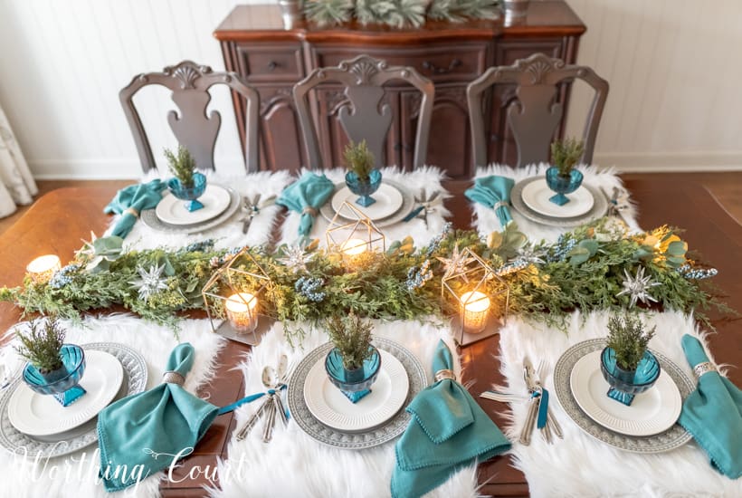 Artificial greenery garland centerpiece down the center or the table.