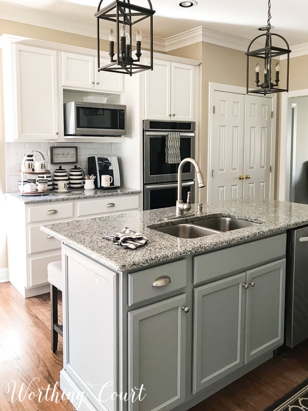kitchen with white cabinets and gray island