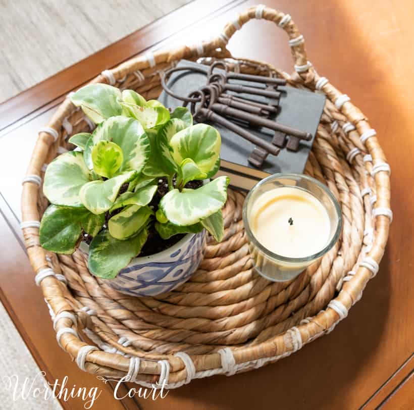 Round wicker tray on a coffee table.