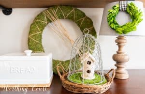 spring vignette with greenery and natural wood elements