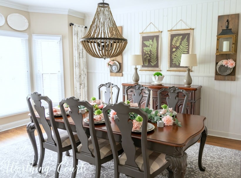 Dining room table with spring floral centerpiece.