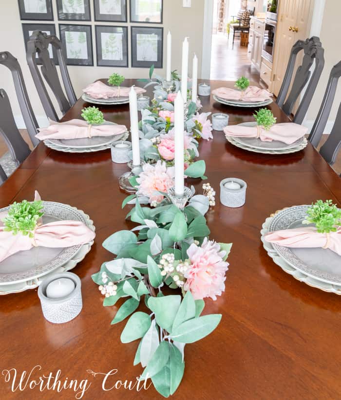 Dining room table with eucalyptus centerpiece.