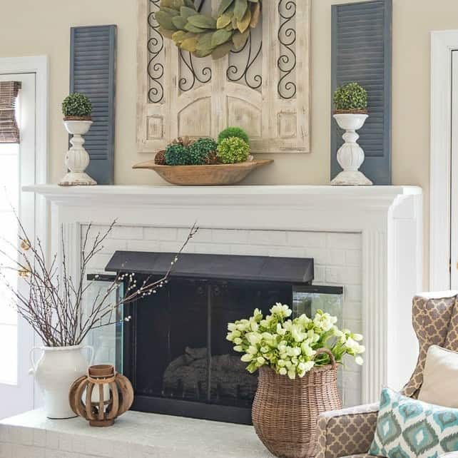 White fireplace decorated for spring.