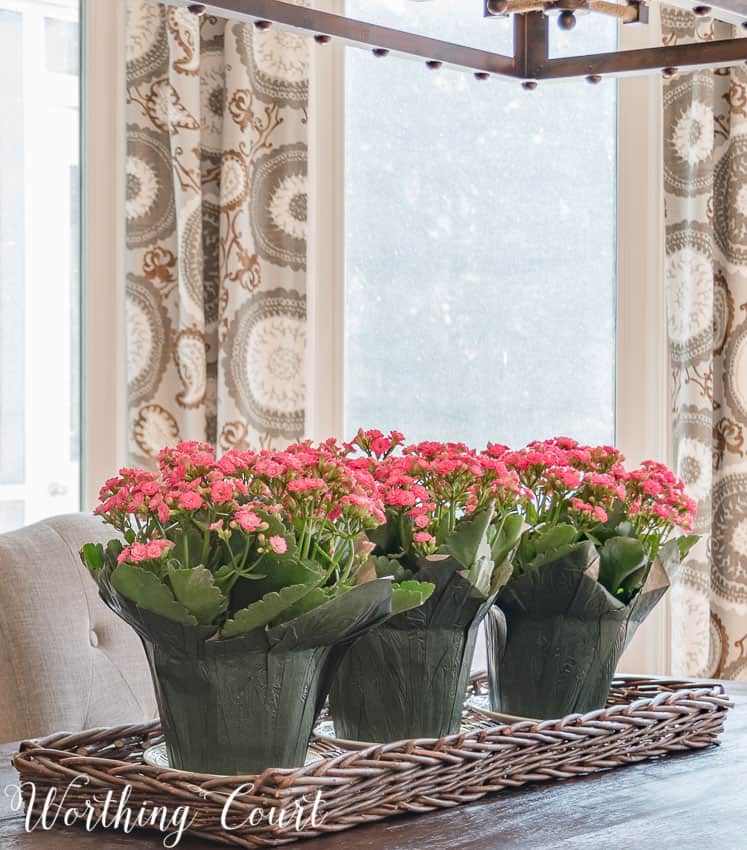 spring centerpiece with flowers in a wicker tray