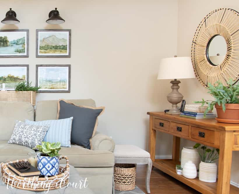 Neutral sofa with gray throw pillows.