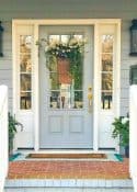 front porch with gray door with sidelights