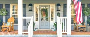 front porch with gray door with sidelights