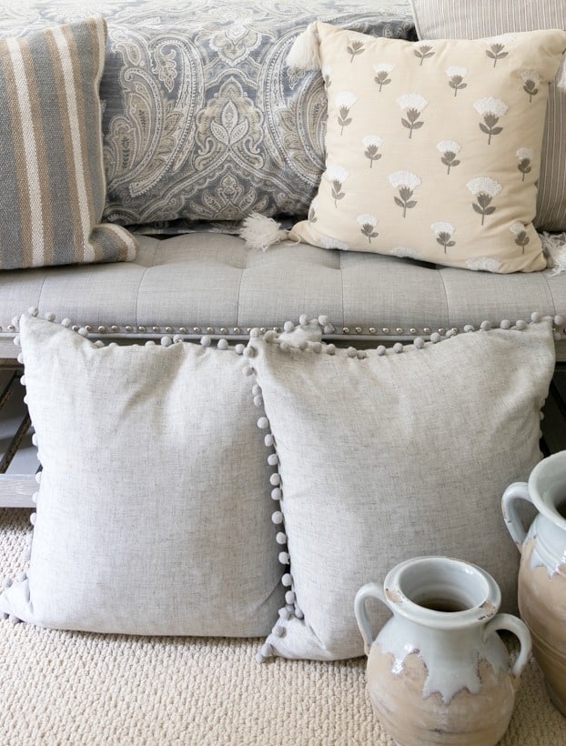 bedding and pillows in neutral colors