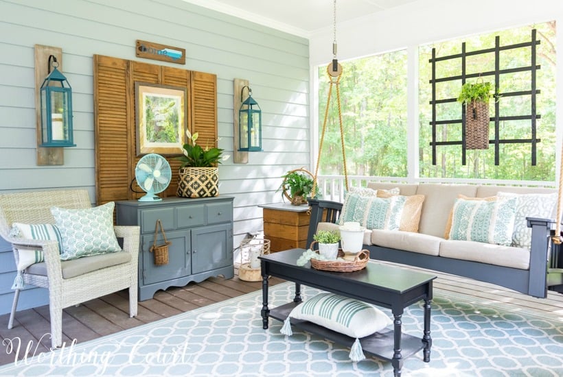 screened in porch decor with a porch swing