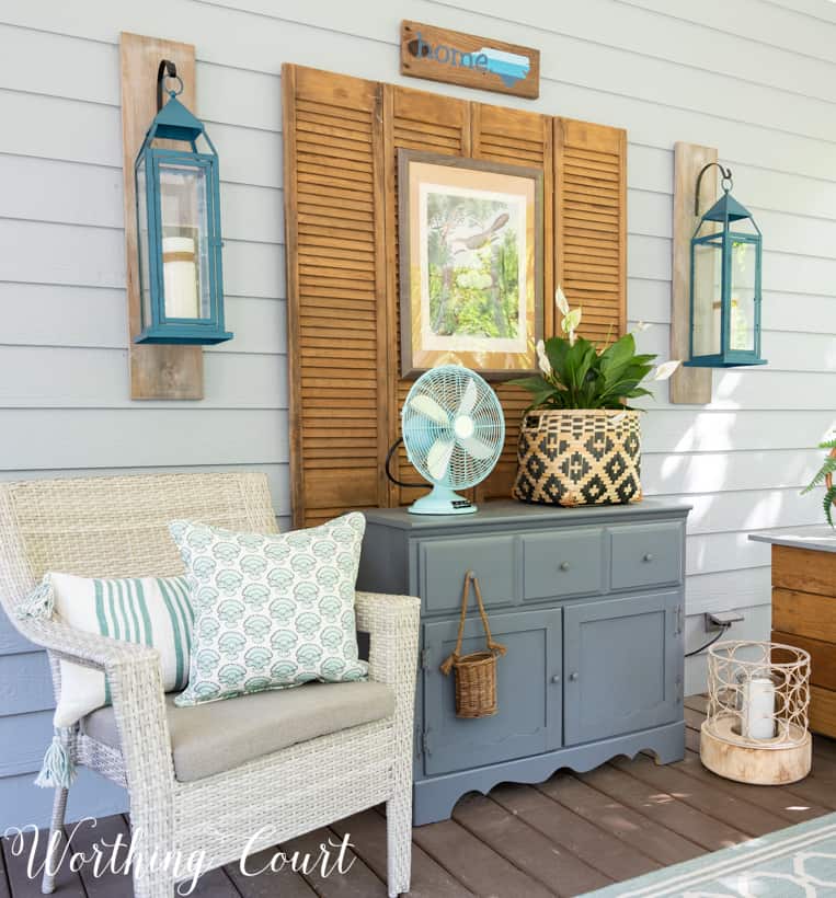 Outdoor chest and small gray chest on a porch.