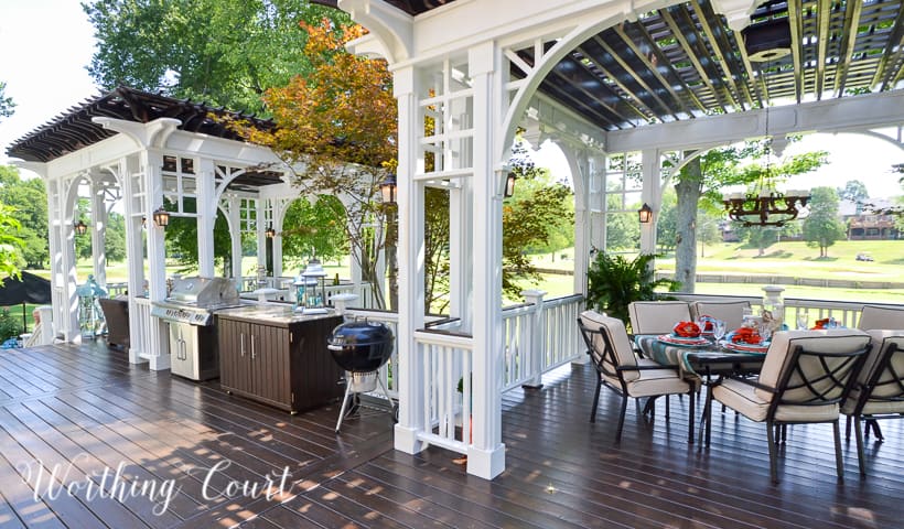 deck with white posts and pergola roof