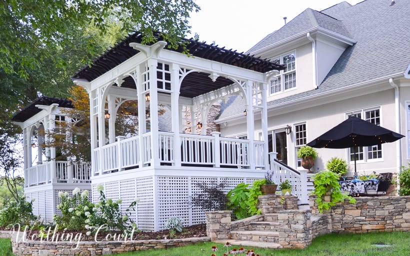 deck with white railing and pergola roof