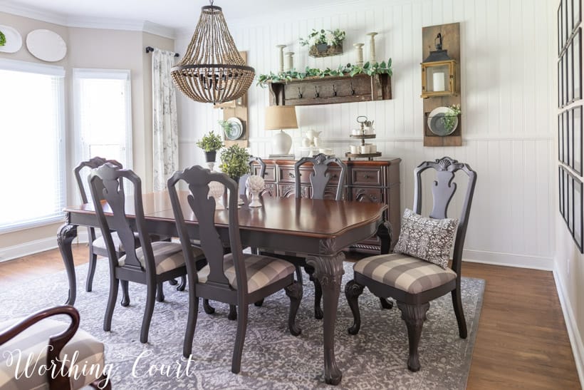 Dining room with white walls and gray painted furniture