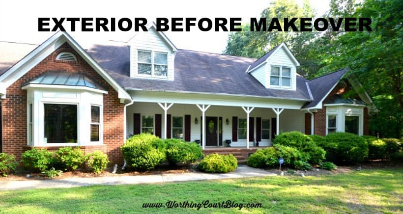 red brick house with long front porch and two dormers