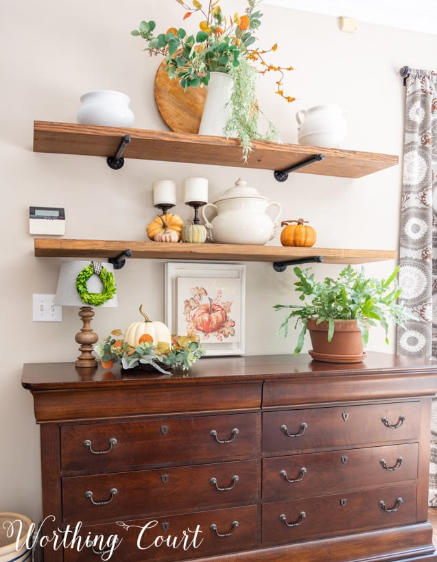 open shelves with fall decorations