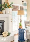 white brick fireplace decorated with soothing fall colors