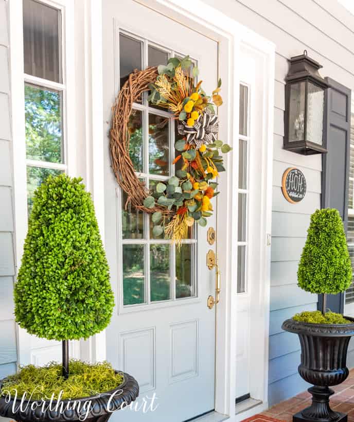 front porch decor ideas with a stunning fall wreath on the door