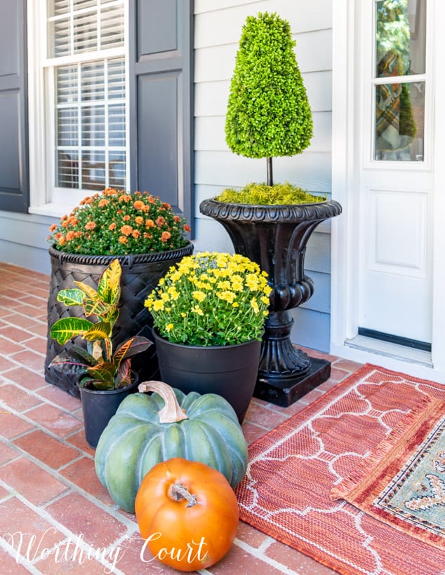 front porch decor ideas grouping mums in different planters