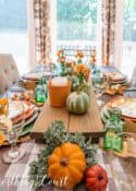 Thanksgiving tablescape using pumpkins and traditional fall colors