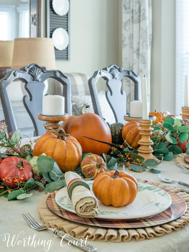 Thanksgiving table set with pumpkins and eucalyptus