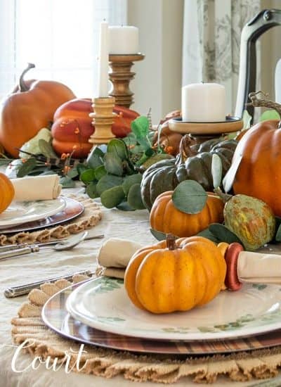 Thanksgiving tablescape with pumpkins and eucalyptus