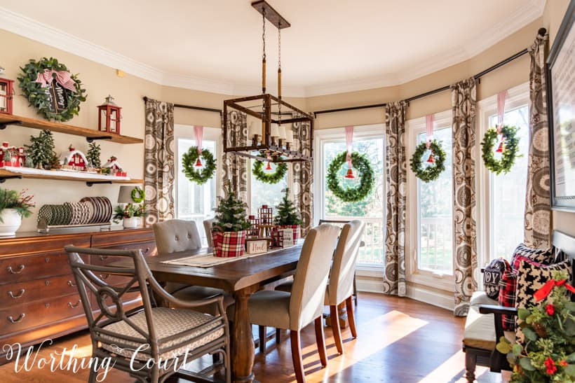 Dining room with red, white and plaid decorations.