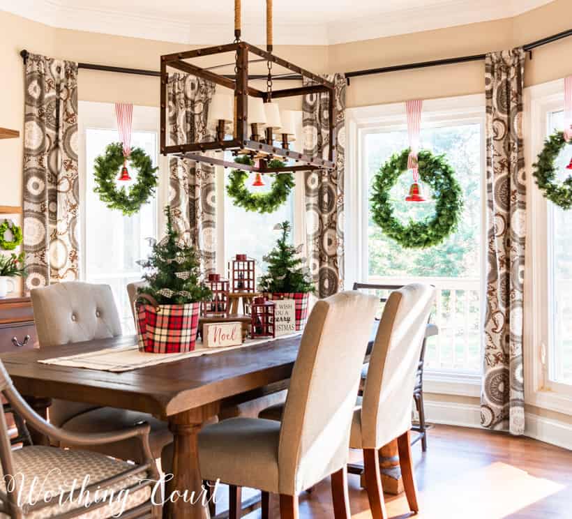 Large bay window with Christmas wreath in each window.