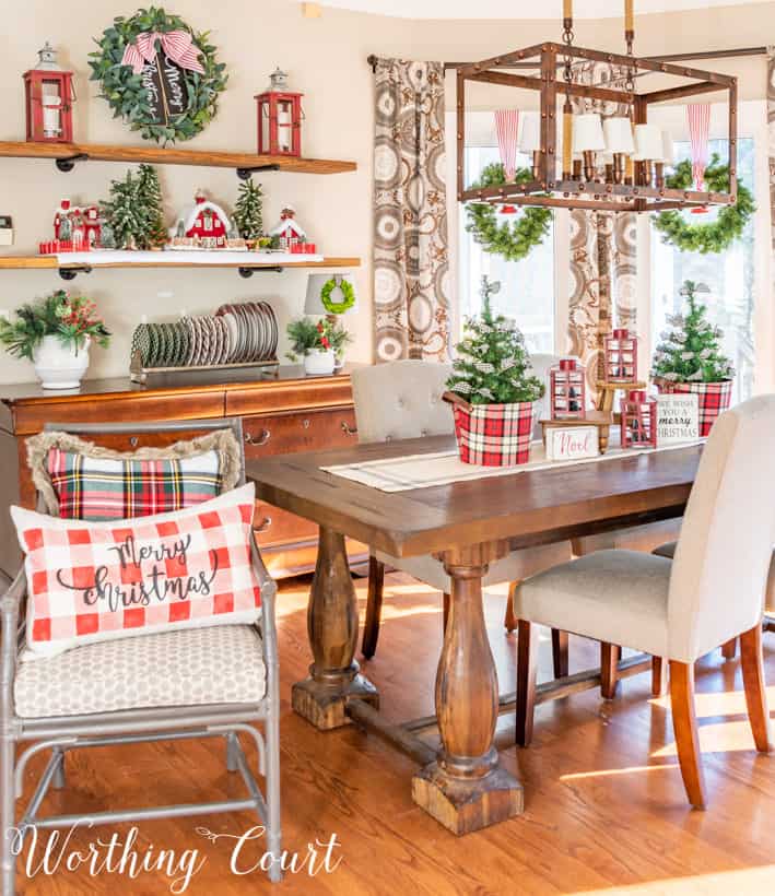 Dining room with red, white and plaid decorations.