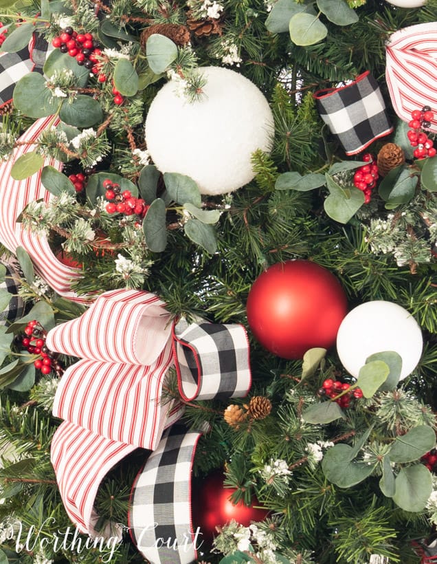 Buffalo check ribbon is on the tree tied in boughs.