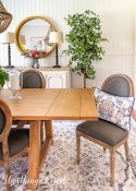 gray chair at end of dining table
