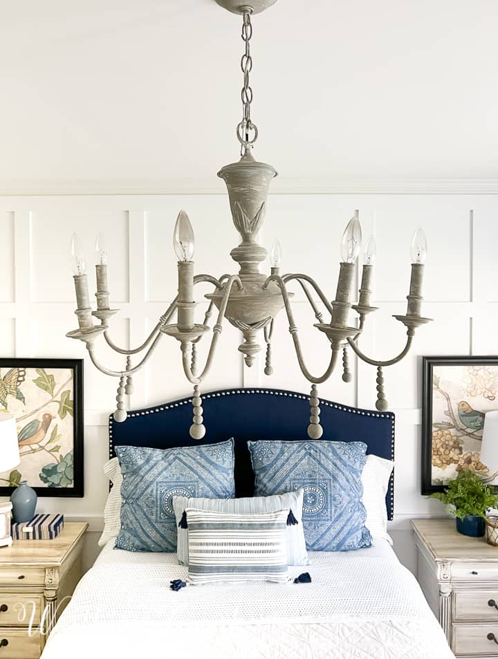 image of chandelier above bed
