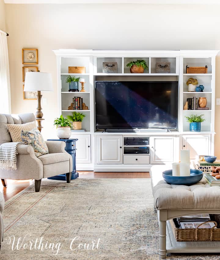 white entertainment center in a family room