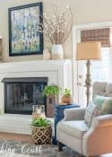 gray recliner beside white painted brick fireplace