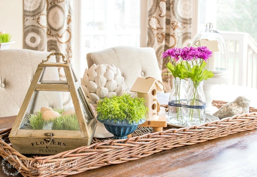 Spring centerpiece in a wicker tray.