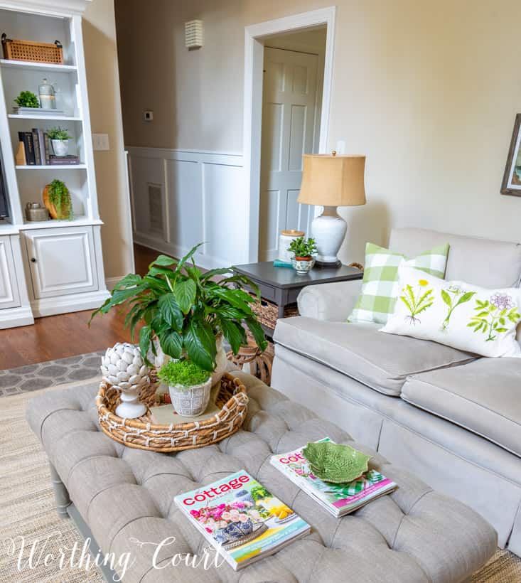 tufted coffee table with summer accessories